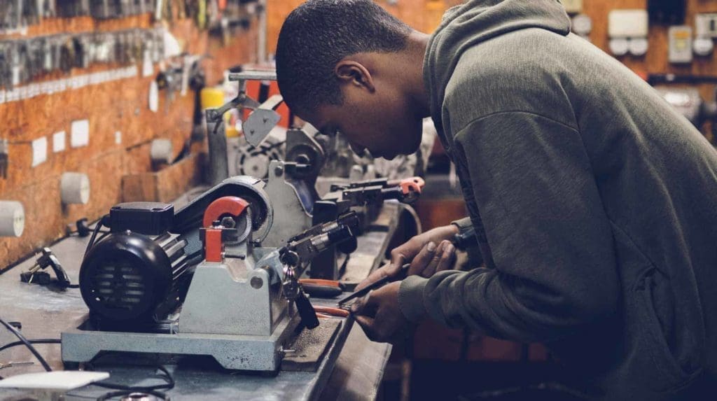 - american hurricane shutters man in a Carolina workshop,