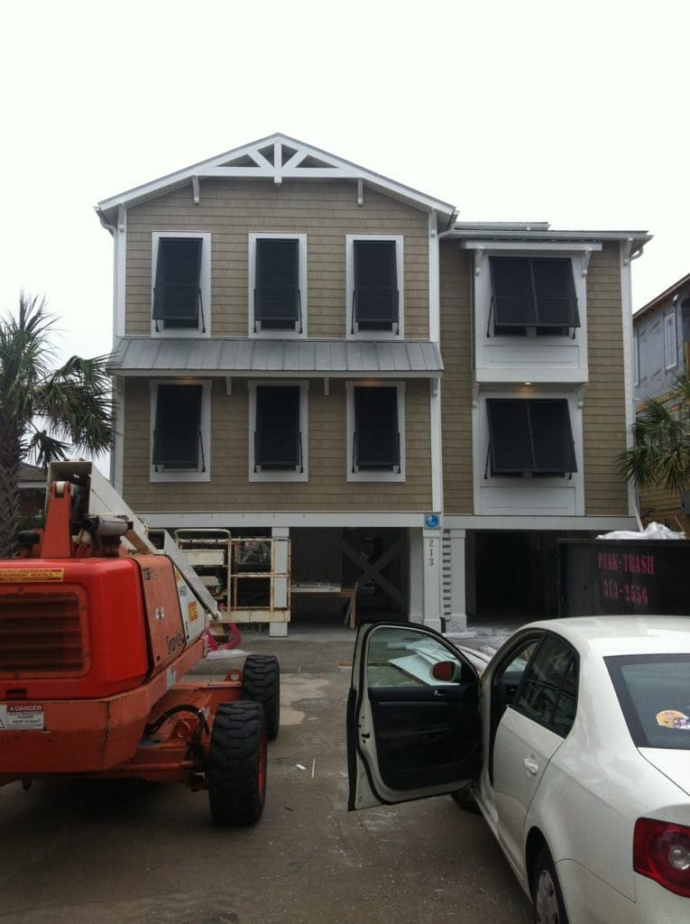 - american hurricane shutters house with black hurricane shutters