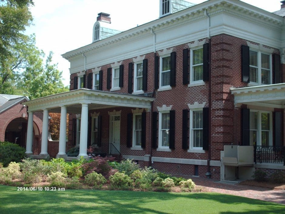 House with impact-resistant hurricane shutters