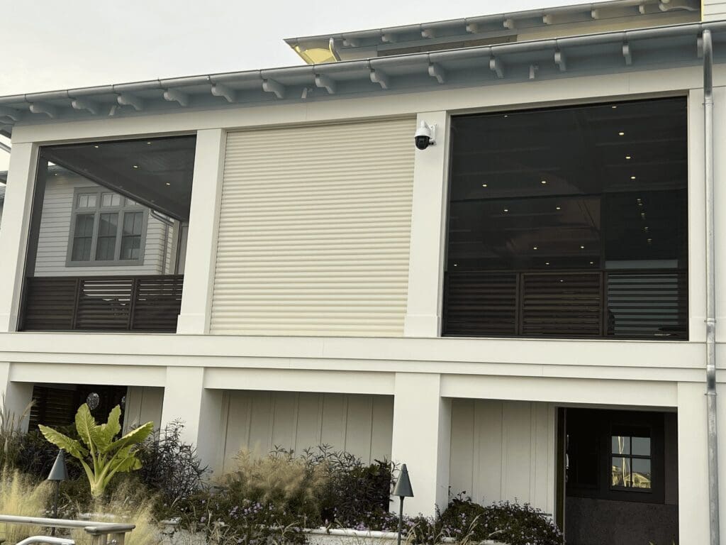 Modern Coastal Home with Hurricane Shutters, Topsail Modern coastal home exterior with hurricane shutters and screens.