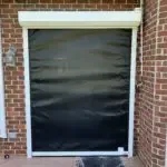 black roll-down storm shutter