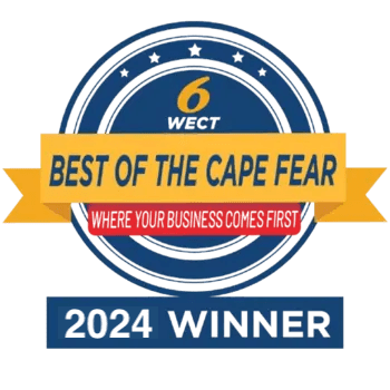 A circular blue and yellow badge with “6 WECT Best of the Cape Fear,” “Where Your Business Comes First,” and “2024 Winner” written on it, highlighting top businesses in Wilmington for hurricane shutters. in either North or South Carolina - American Hurricane Shutters A circular blue and yellow badge with “6 WECT Best of the Cape Fear,” “Where Your Business Comes First,” and “2024 Winner” written on it, highlighting top businesses in Wilmington for hurricane shutters. in either North or South Carolina