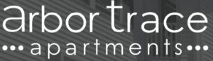 Arbor Trace Apartments logo against modern building exterior.
